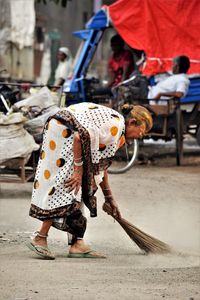 Rear view of people walking on street