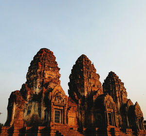 Low angle view of antique temple against sky, phra prang sam yod, lop buri. 