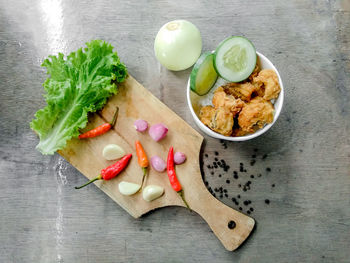 High angle view of vegetables on cutting board