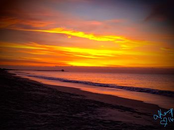 Scenic view of beach against sky during sunset