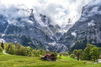 Wide valley and farmland in grindelwald covered in clouds. famous tourist landmark in switzerland