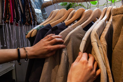 Midsection of man wearing shoes at store