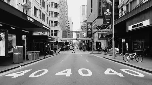 High angle view of numbers on street amidst buildings in city