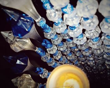 High angle view of coins in glass container