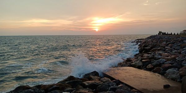 Scenic view of sea against sky during sunset