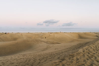 Scenic view of beach against clear sky