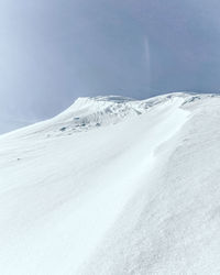 Scenic view of snowcapped mountain against sky