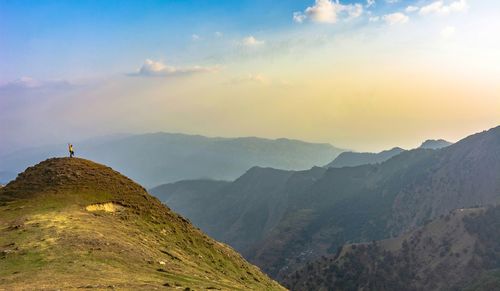 Scenic view of mountains against sky during sunset