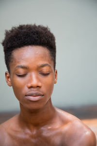 Close-up of shirtless young woman