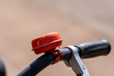 Close-up of hand holding bicycle