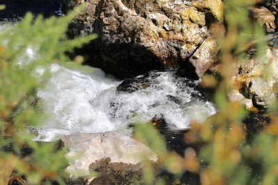 Close-up of water flowing through rocks