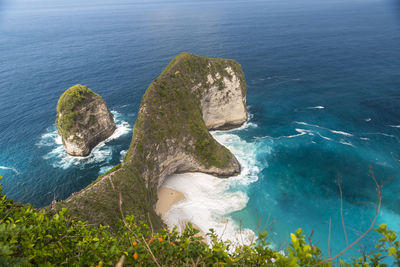 High angle view of rocks on sea shore