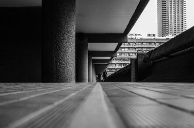 Ground level rear view of two people walking in far distance