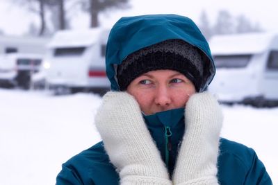 Thoughtful woman looking away during winter