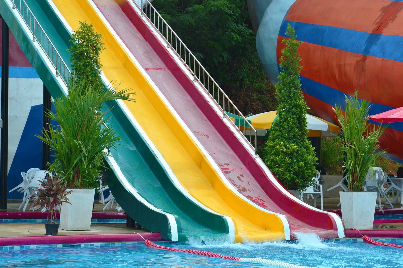 VIEW OF SWIMMING POOL BY PLAYGROUND