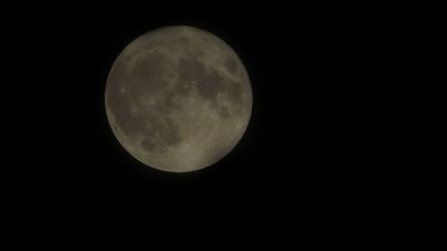 Scenic view of moon against black sky