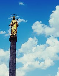 Low angle view of statue against cloudy sky