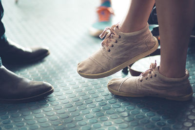 Low section of people standing on floor