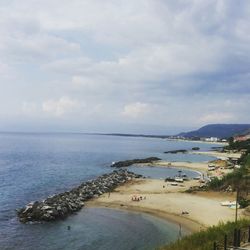 Scenic view of sea against cloudy sky