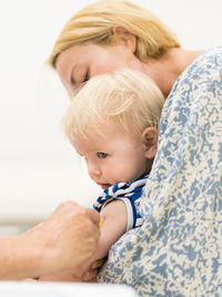 Close-up of cute baby boy at home