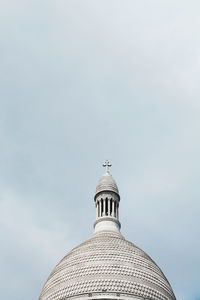 Low angle view of basilique du sacre coeur against cloudy sky