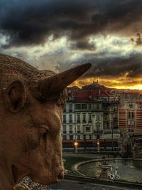 Close-up of statue against sky in city