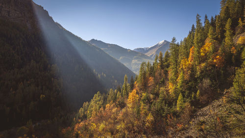 Scenic view of mountains against clear sky during autumn