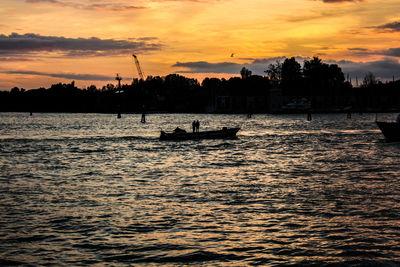 Silhouette of boat at sunset