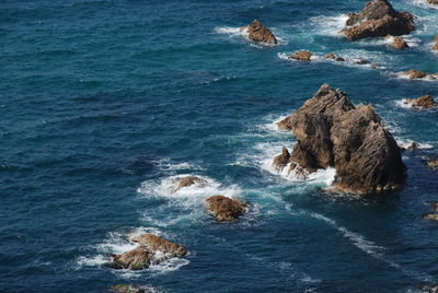 High angle view of rock formation in sea