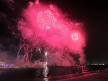 Firework display at night