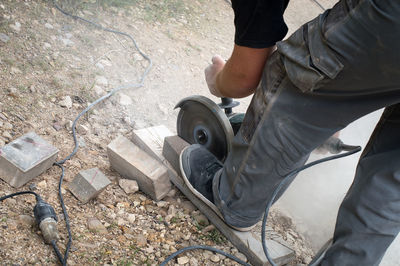 Low section of man working at construction site