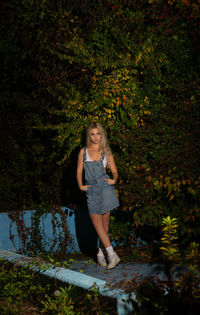 Portrait of a teenage girl standing in autumn