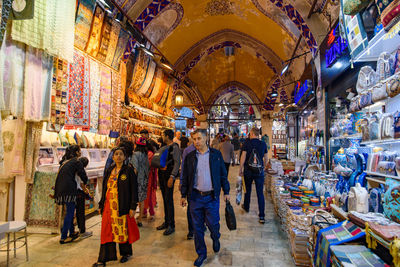 People walking in illuminated market