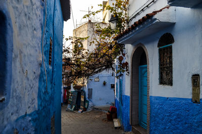 Narrow alley amidst buildings in city