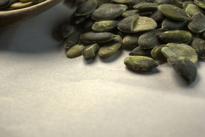 Close-up of roasted coffee beans on table