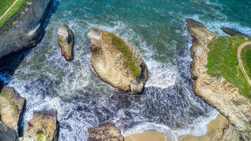 High angle view of rock formation in sea