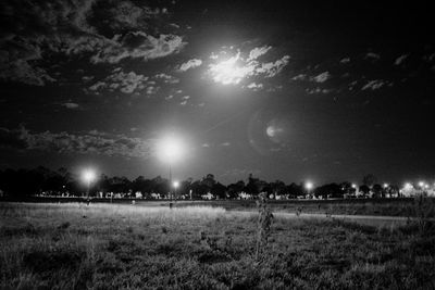 Scenic view of field against sky at night