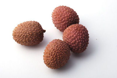 Close-up of fruits against white background