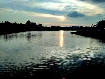 Scenic view of lake against sky during sunset