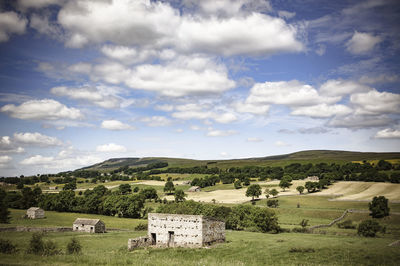 Scenic view of landscape against cloudy sky