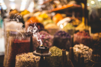 Close-up of burning candles in temple