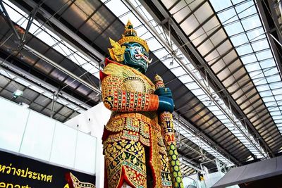 Low angle view of statue against building