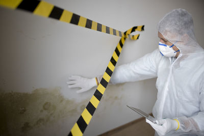 High angle view of doctor holding equipment