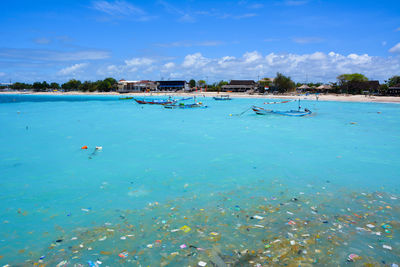 Scenic view of beach against blue sky