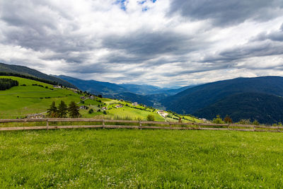 Scenic view of landscape and mountains against sky