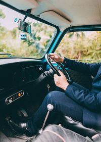 Man sitting in car