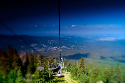 Scenic view of mountain against blue sky