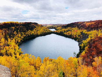 Scenic view of lake against sky during autumn