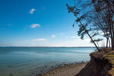 Scenic view of sea against blue sky