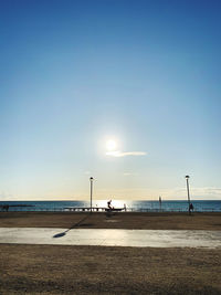 Scenic view of beach against sky during sunset